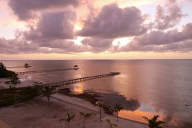 Ambergris Caye sunrise over three piers – Best Places In The World To Retire – International Living
